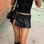Embrace bold fashion with this punk-inspired leather mini skirt featuring a flattering A-line cut for an edgy look.