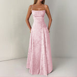 Pink evening gown on a plain background