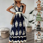 A stylish model wearing an elegant floral V-neck midi dress in a dark blue color. The dress has a waist-cinched design and a beautiful positional flower pattern, perfect for an elegant commuting style.
