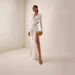 White or black long dress with metal cross-lace, halter neck, and V-neck.