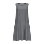 A sleeveless, mid-length A-line tank dress with a round neck.