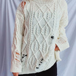 Distressed Cable-Knit Round Neck Long Sleeve Sweater -runwayfashionista.com