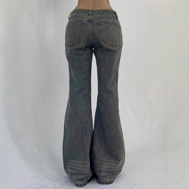 Flared jeans on a plain background