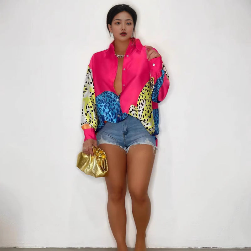 A loose-fit, long-sleeve shirt with a striking animal print pattern.