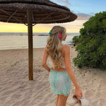 A light green ultra-short A-line skirt featuring 3D embroidery, tulle, and sequin flower details.