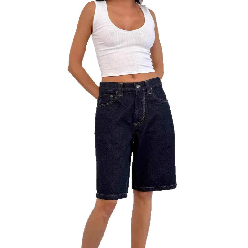 A pair of dark blue, mid-length, vintage-style denim shorts with a distressed finish. The shorts are laid flat, showcasing the straight-leg cut and medium-rise waist.