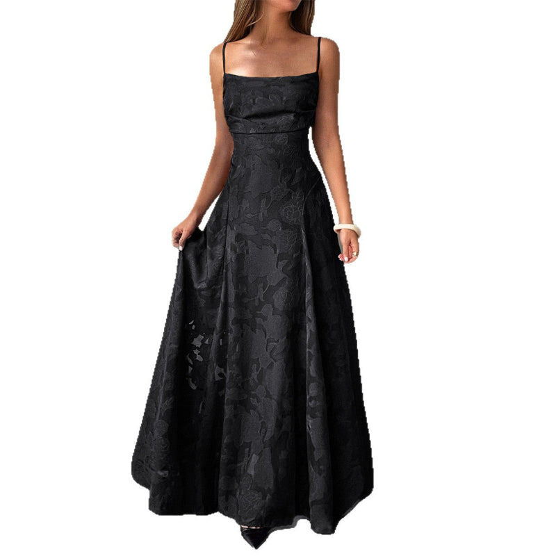 Black floral-patterned dress on a white background
