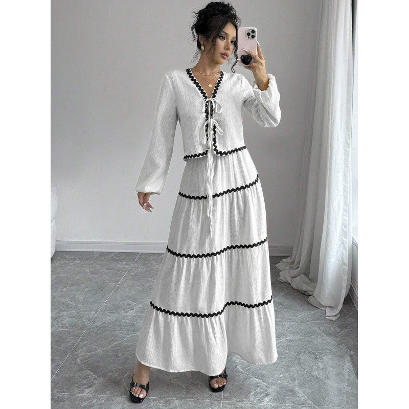 Shape a confident, elegant A-line silhouette with this stylish two-piece set.