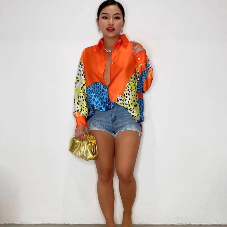 A loose-fit, long-sleeve shirt with a striking animal print pattern.