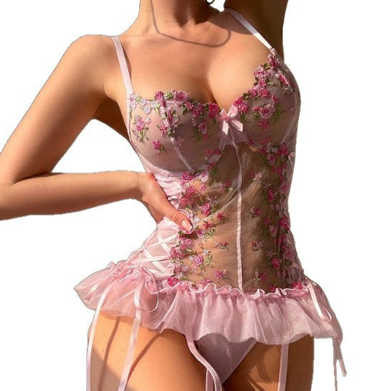 Close-up of a pink transparent floral embroidered mesh romper lingerie set for women.