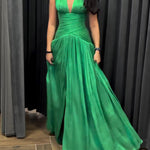 Emerald Green Plunging Neckline Gown With Pleated Skirt And Side Slit