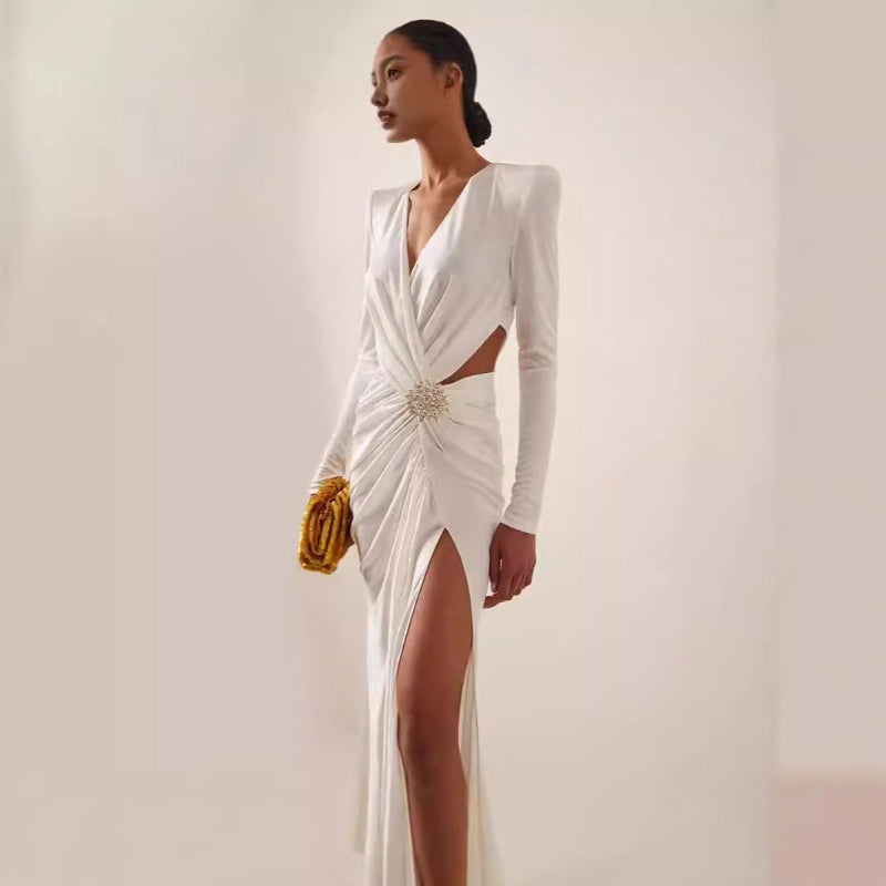 White or black long dress with metal cross-lace, halter neck, and V-neck.