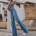 Ripped Loose Flared Jeans - runwayfashionista.com