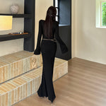 The Black V-Neck Midi: Beading, Boldness & Glamour