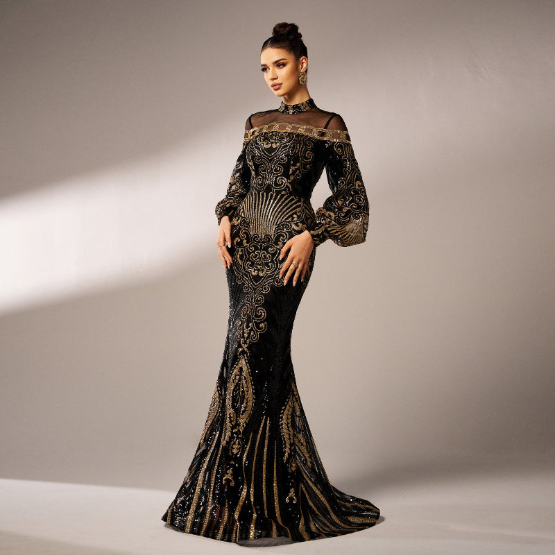 Woman wearing a black and gold evening gown against a neutral background
