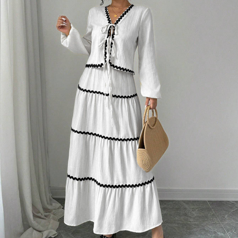 Shape a confident, elegant A-line silhouette with this stylish two-piece set.