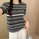 This bold round neck tee with short sleeves offers effortless style and comfort for every daring look.