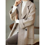 New herringbone patterned woollen coat