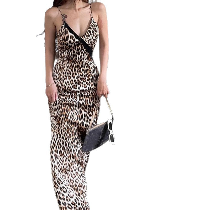 A full-length shot of a person wearing a fitted, strapless midi dress with a retro leopard print pattern. The dress features a high waist and a backless design.