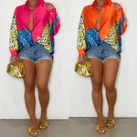 A loose-fit, long-sleeve shirt with a striking animal print pattern.