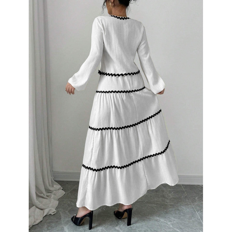 Shape a confident, elegant A-line silhouette with this stylish two-piece set.