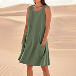 A sleeveless, mid-length A-line tank dress with a round neck.