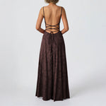 Brown dress with open back on a white background