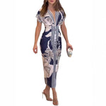 Woman wearing a patterned dress on a white background