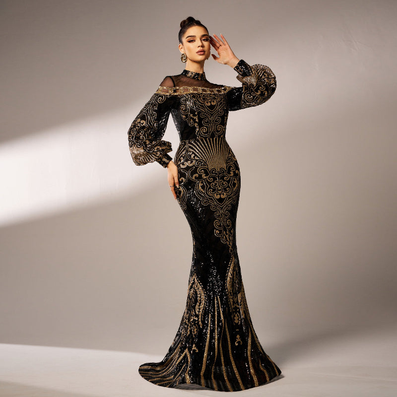 Woman wearing a black and gold evening gown against a neutral background