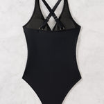 This high-waist swimsuit features a daring crossed design that sculpts and flatters your figure with slimming appeal.