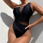 Make a bold statement with this daring mesh one-piece swimsuit, perfect for turning heads and feeling confident.