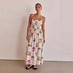 A model wearing a floral print, one-shoulder, sleeveless, A-line midi dress with a high waist, suitable for business or elegant events.