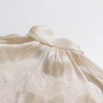 Apricot Cream Satin Cold-Shoulder High-Halter Billowy Sleeve Ruffled-Cuff Asymmetric Blouse