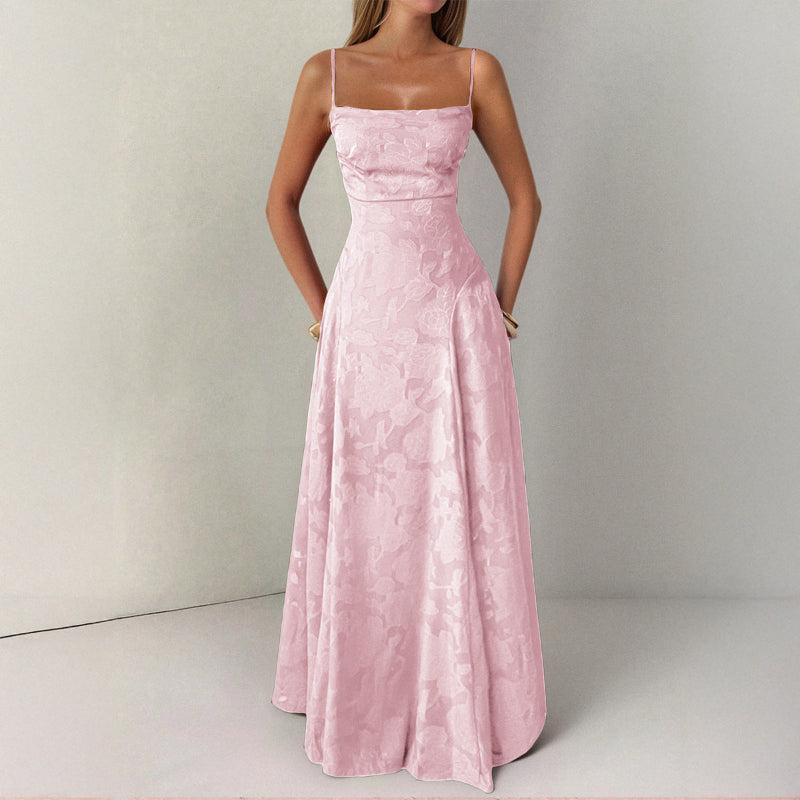 Pink evening gown on a plain background