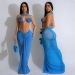 A model wearing a blue backless string halter bikini set.