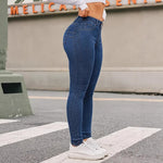 A pair of blue, high-waisted, skinny-fit denim jeans for women. The jeans are made from a stretchy fabric and have a tapered leg that ends at the ankle. They are suitable for a casual style.
