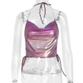 A person wearing a purple sleeveless halter top with a slim fit and backless design, suitable for street style.