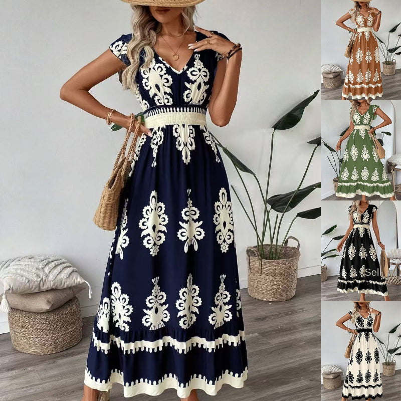 A stylish model wearing an elegant floral V-neck midi dress in a dark blue color. The dress has a waist-cinched design and a beautiful positional flower pattern, perfect for an elegant commuting style.