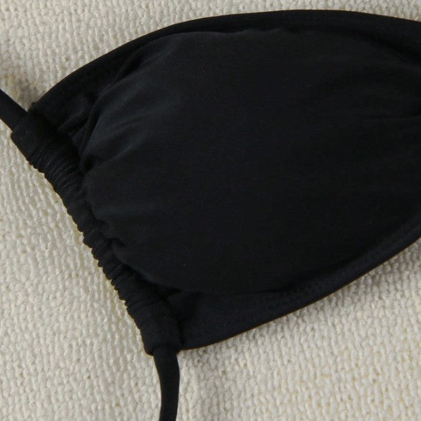This bikini features thin straps and a tie-back design for a bold, confident beach look.