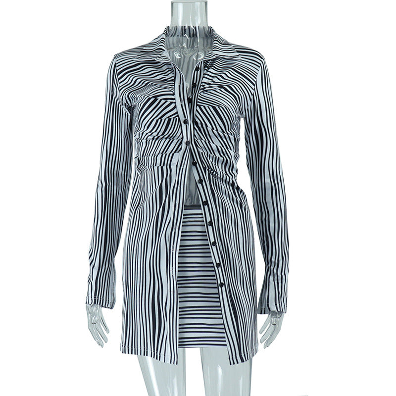 A woman wearing a black striped, long-sleeve, single-breasted shirt with a matching mini skirt, showcasing a European and American style.