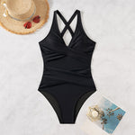 This high-waist swimsuit features a daring crossed design that sculpts and flatters your figure with slimming appeal.