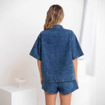 This denim suit features a stretchy elastic waist for bold style and comfortable wear.