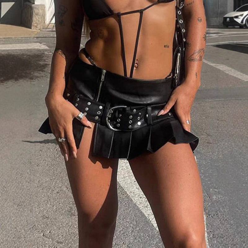 Embrace bold fashion with this punk-inspired leather mini skirt featuring a flattering A-line cut for an edgy look.