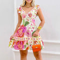 A multi-colored floral A-line midi dress with a U-neck and ruffle details.
