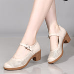 A pair of hollow sandals with a buckle closure, round toe, and low heel, showcasing the casual style and comfortable design.