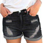 A pair of black, distressed denim shorts with a cuffed hem. The shorts have a loose fit and a mid-rise waist, showcasing a casual yet stylish look.