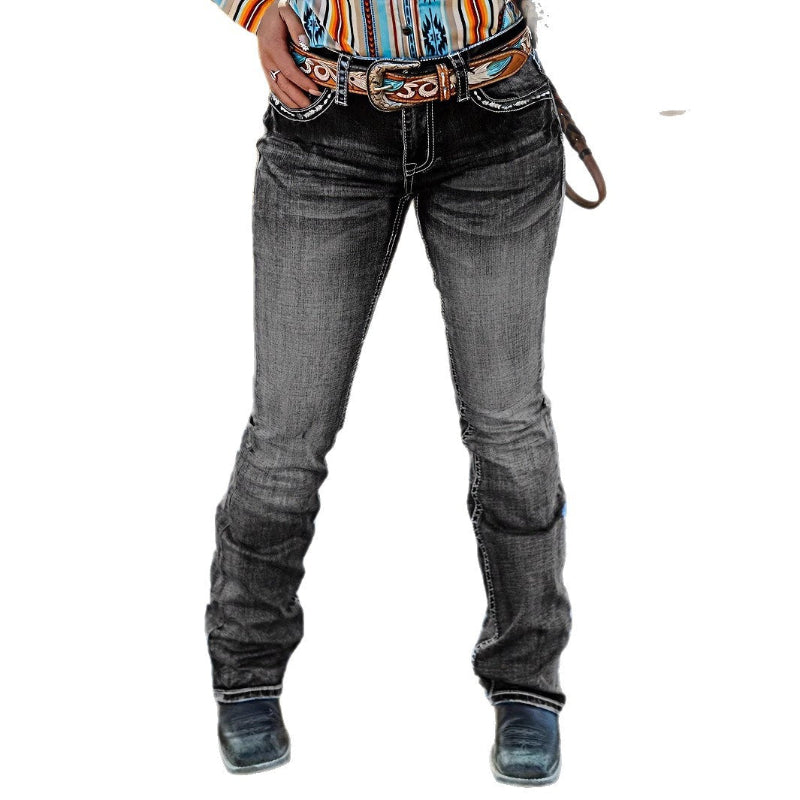 A pair of dark blue, high-waist, straight-leg denim jeans with subtle embroidery and a tie-dye gradient effect. The jeans are displayed flat, showcasing the style and texture.