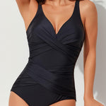 This high-waist swimsuit features a daring crossed design that sculpts and flatters your figure with slimming appeal.