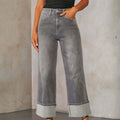 A pair of light blue, faded, straight leg high-waisted jeans for women.