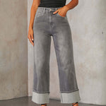 A pair of light blue, faded, straight leg high-waisted jeans for women.